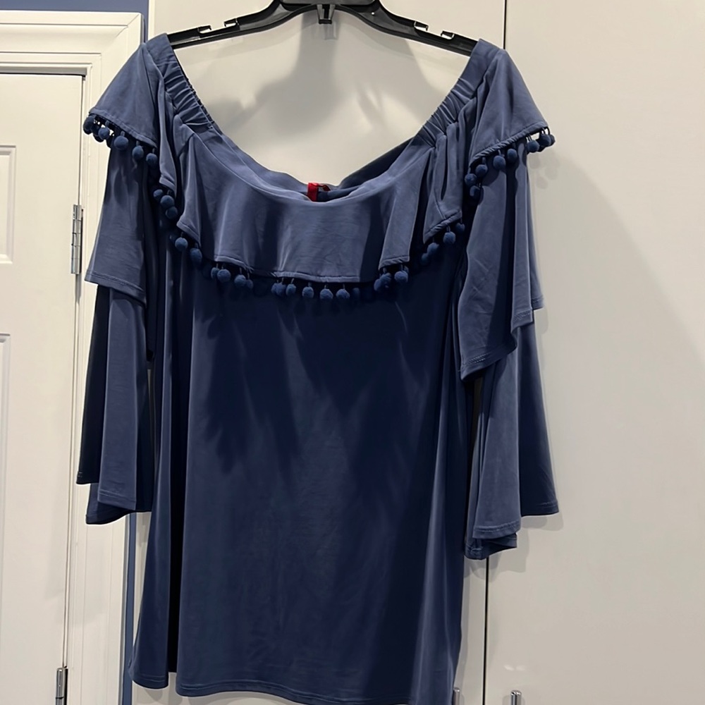 Navy blue off should top with pom poms.